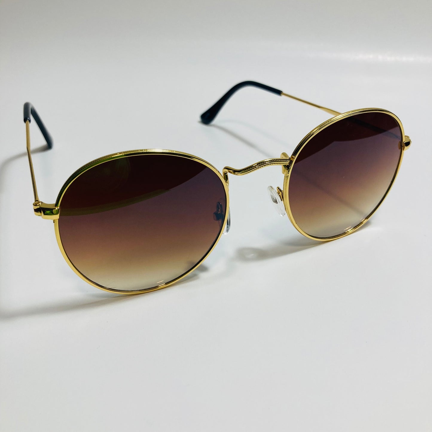 mens and womens round gold sunglasses with brown lenses