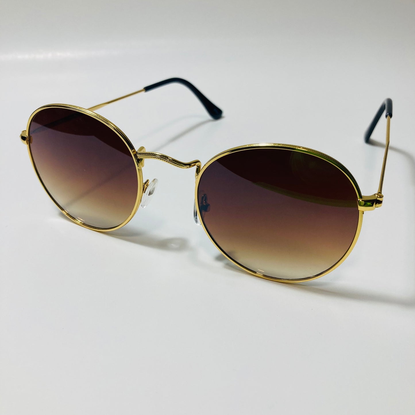mens and womens round gold sunglasses with brown lenses