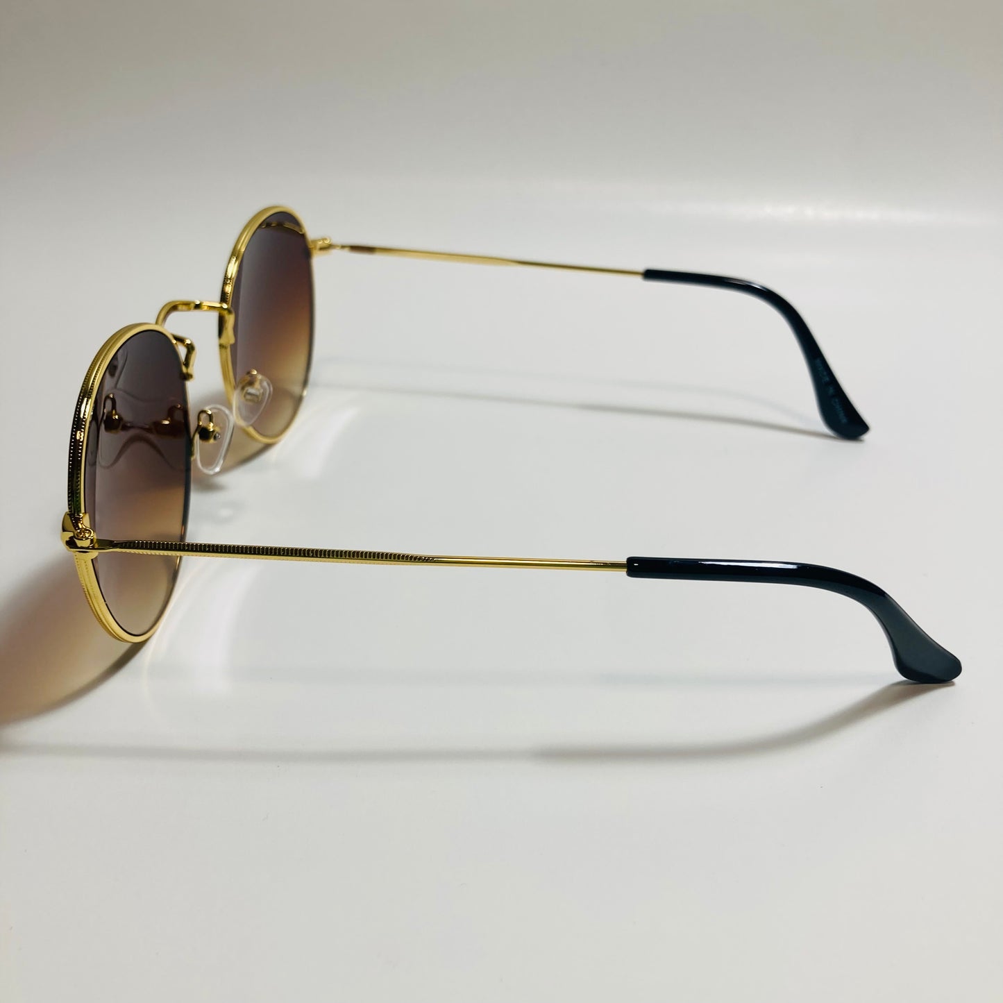 mens and womens round gold sunglasses with brown lenses