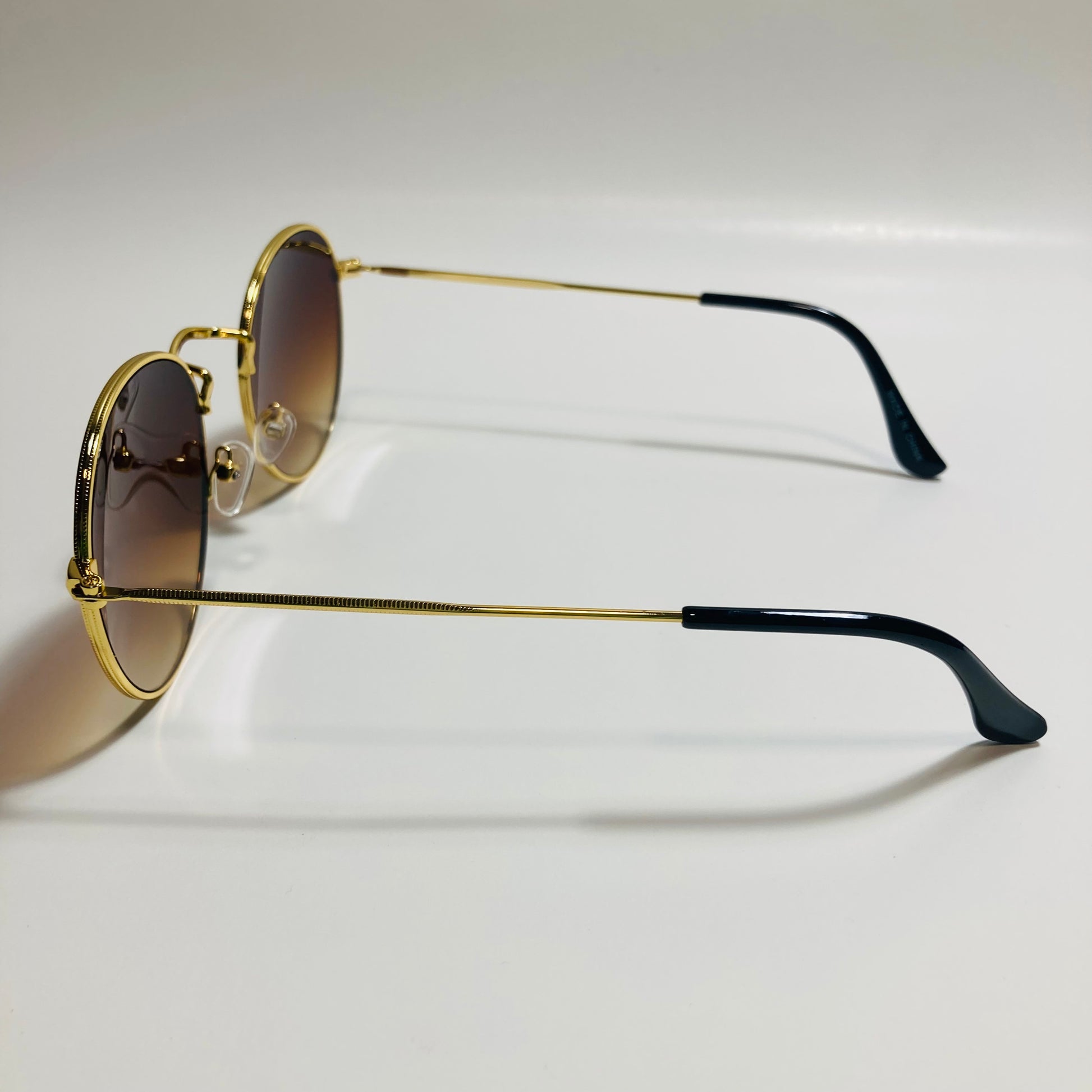 mens and womens round gold sunglasses with brown lenses