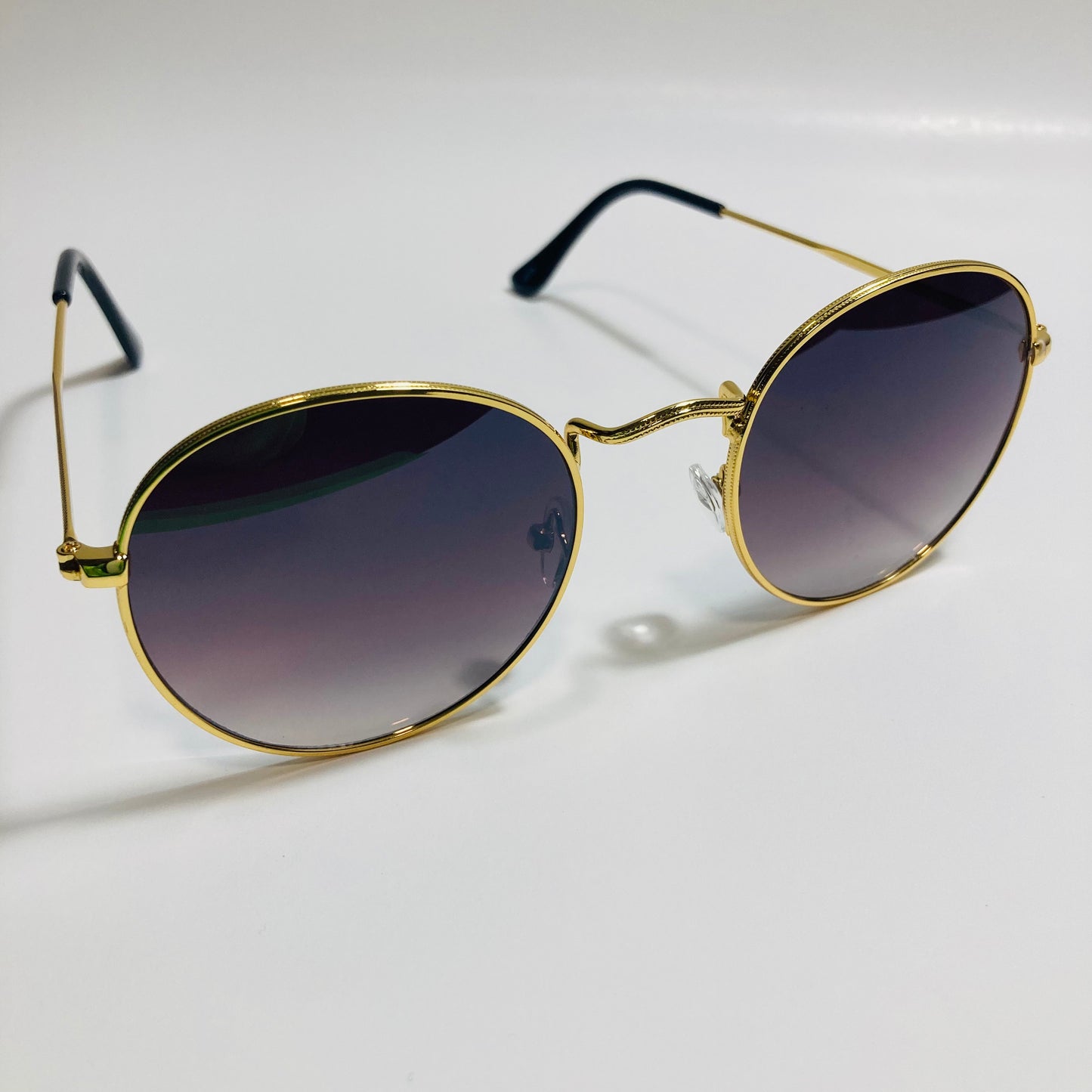 mens and womens round gold sunglasses with black lenses