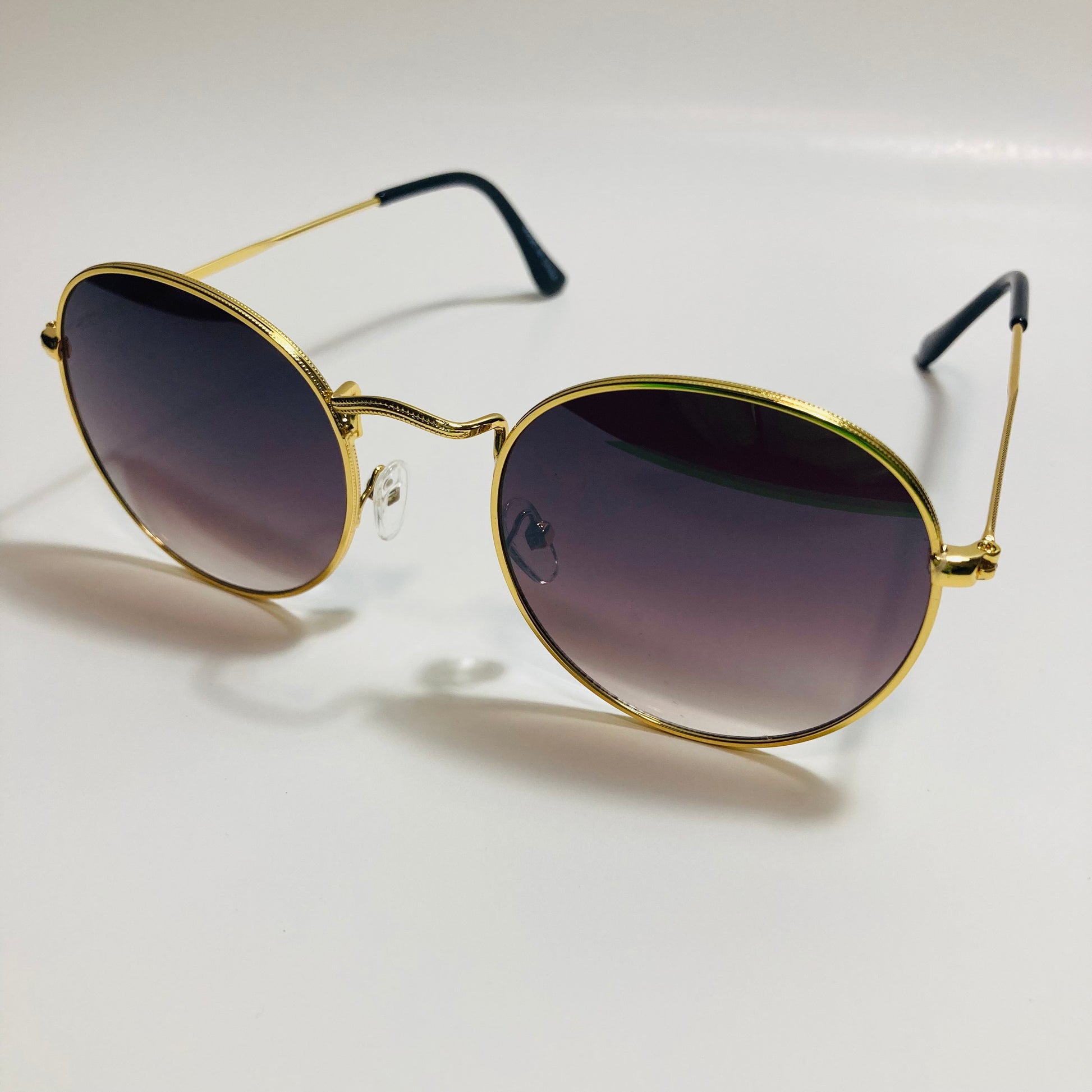 mens and womens round gold sunglasses with black lenses
