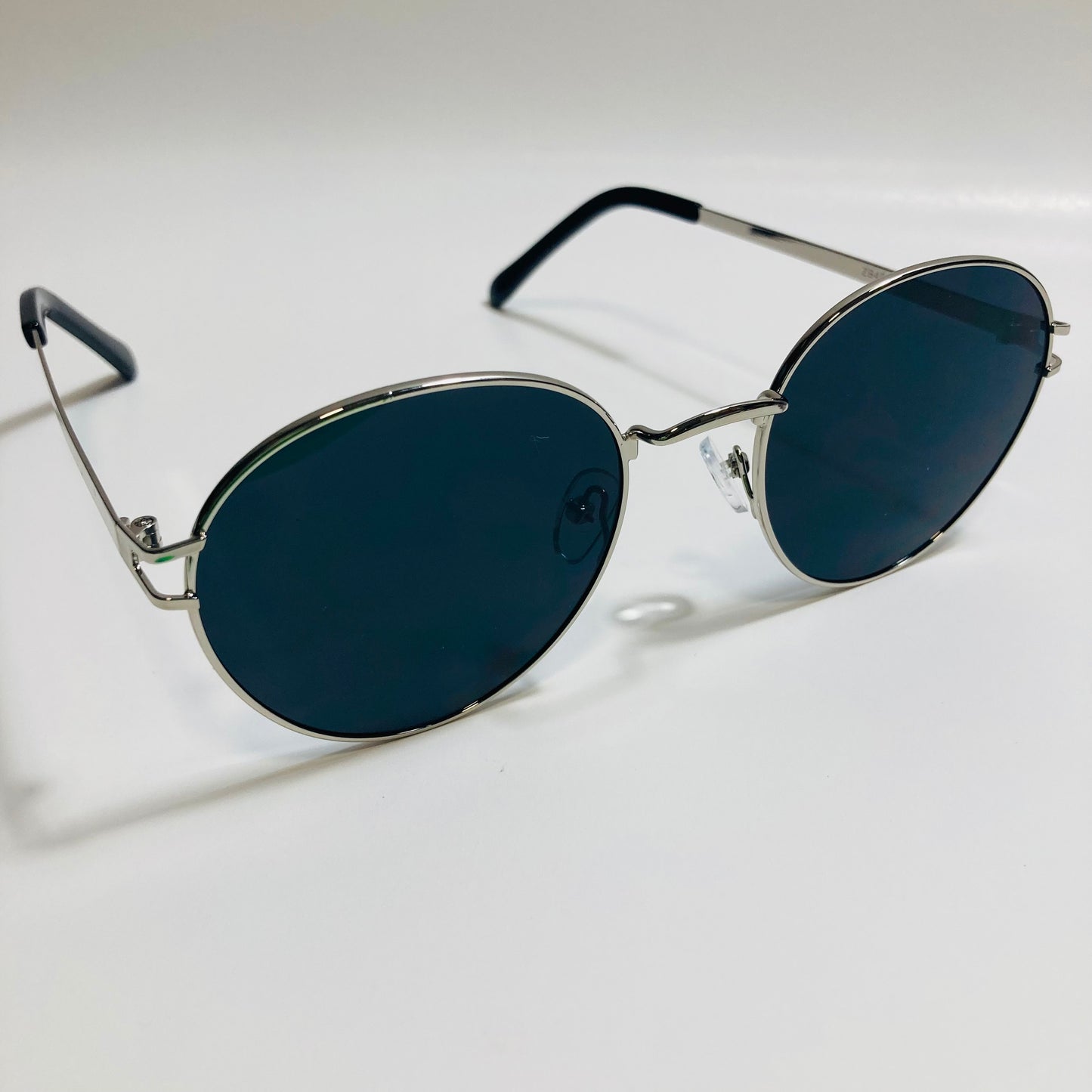 mens and womens black and silver metal round sunglasses