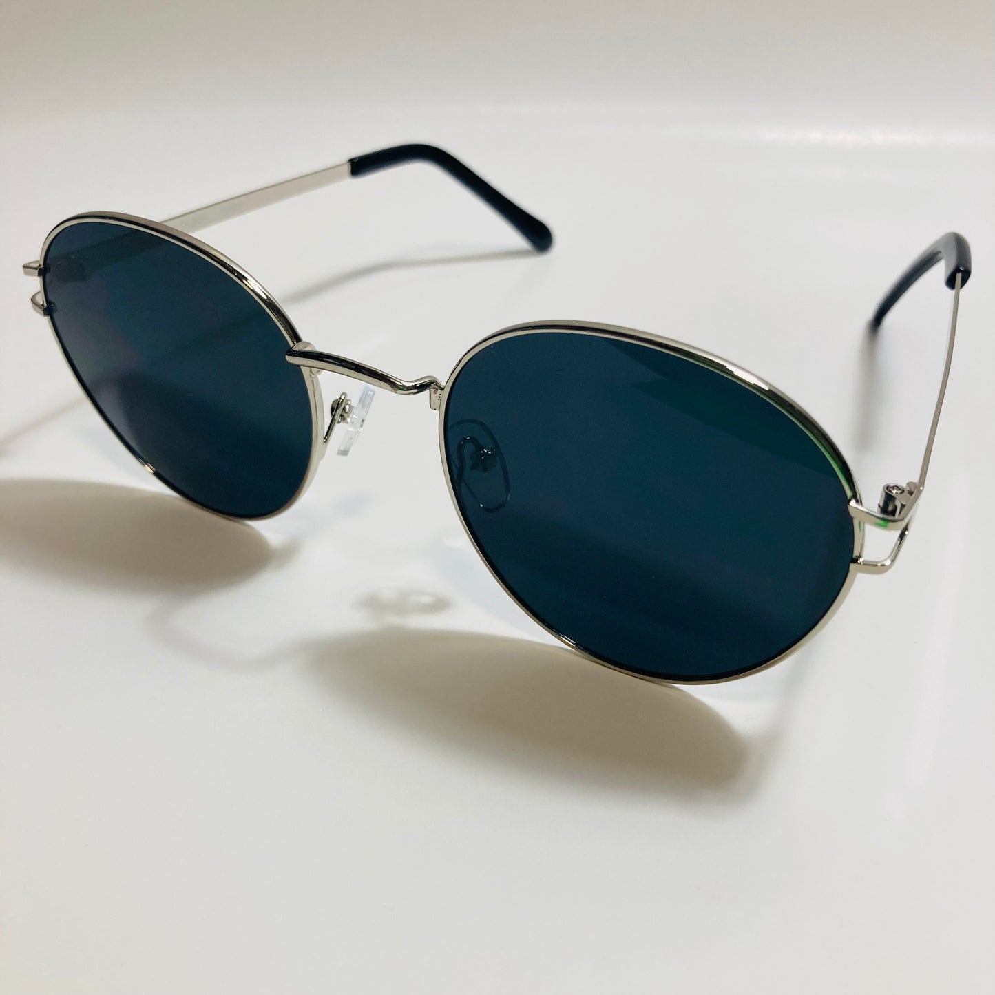 mens and womens black and silver metal round sunglasses