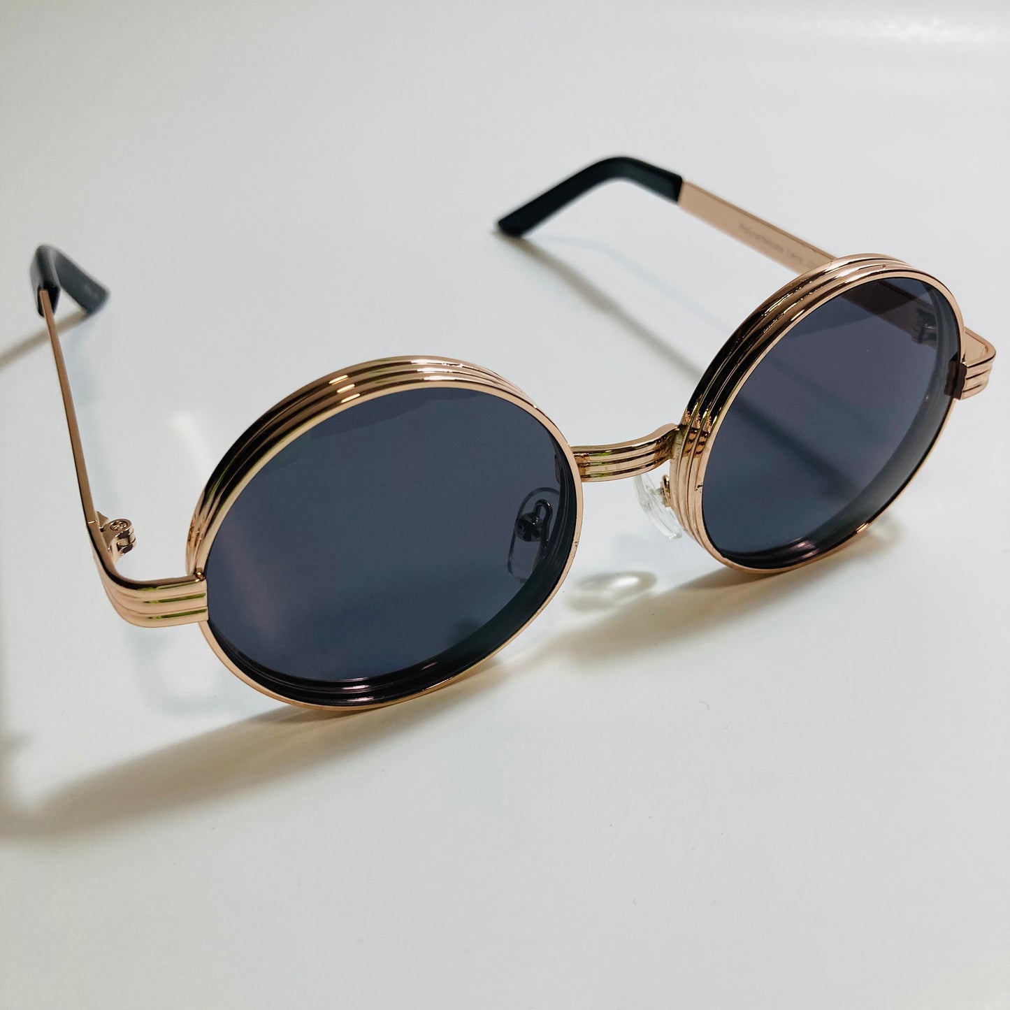 mens and womens black and gold round steampunk sunglases