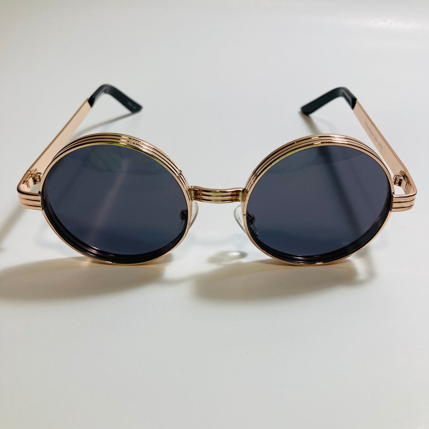 mens and womens black and gold round steampunk sunglases
