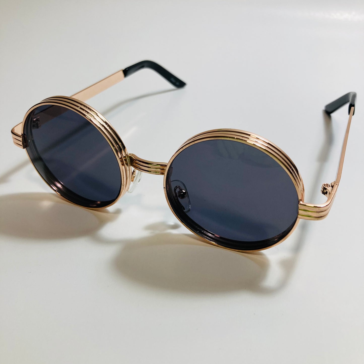 mens and womens black and gold round steampunk sunglases
