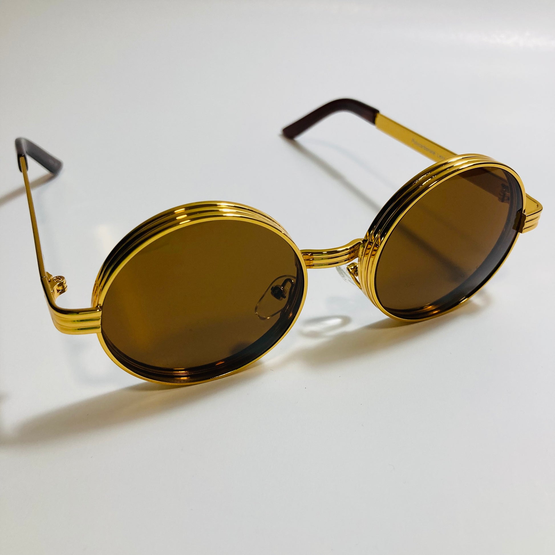 mens and womens brown and gold round steampunk sunglases