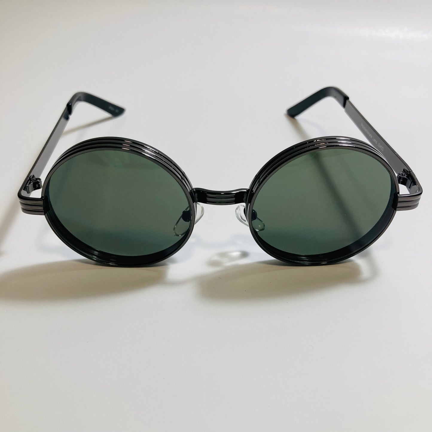 mens and womens black and green round steampunk sunglases