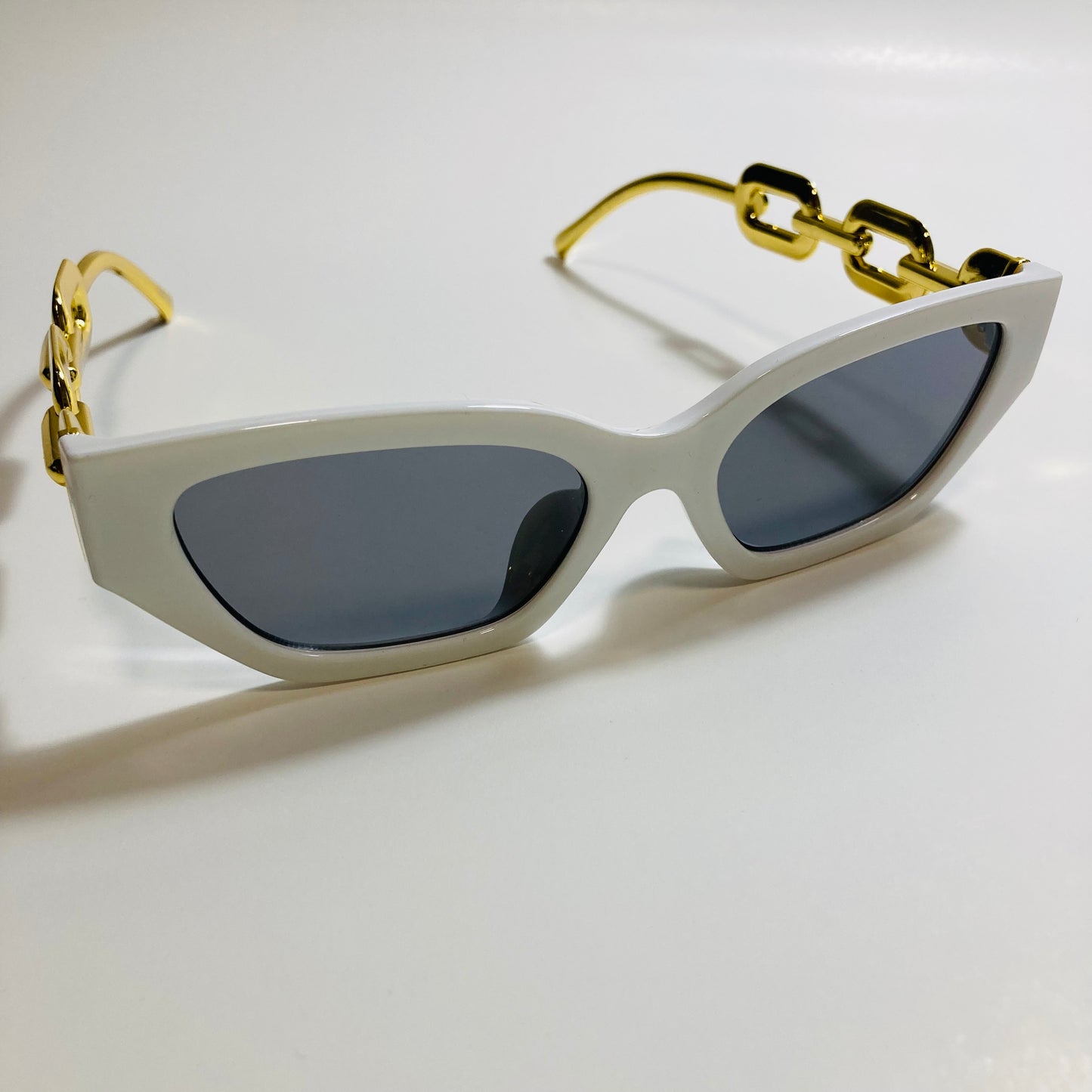 white and black square womens sunglasses with gold arms