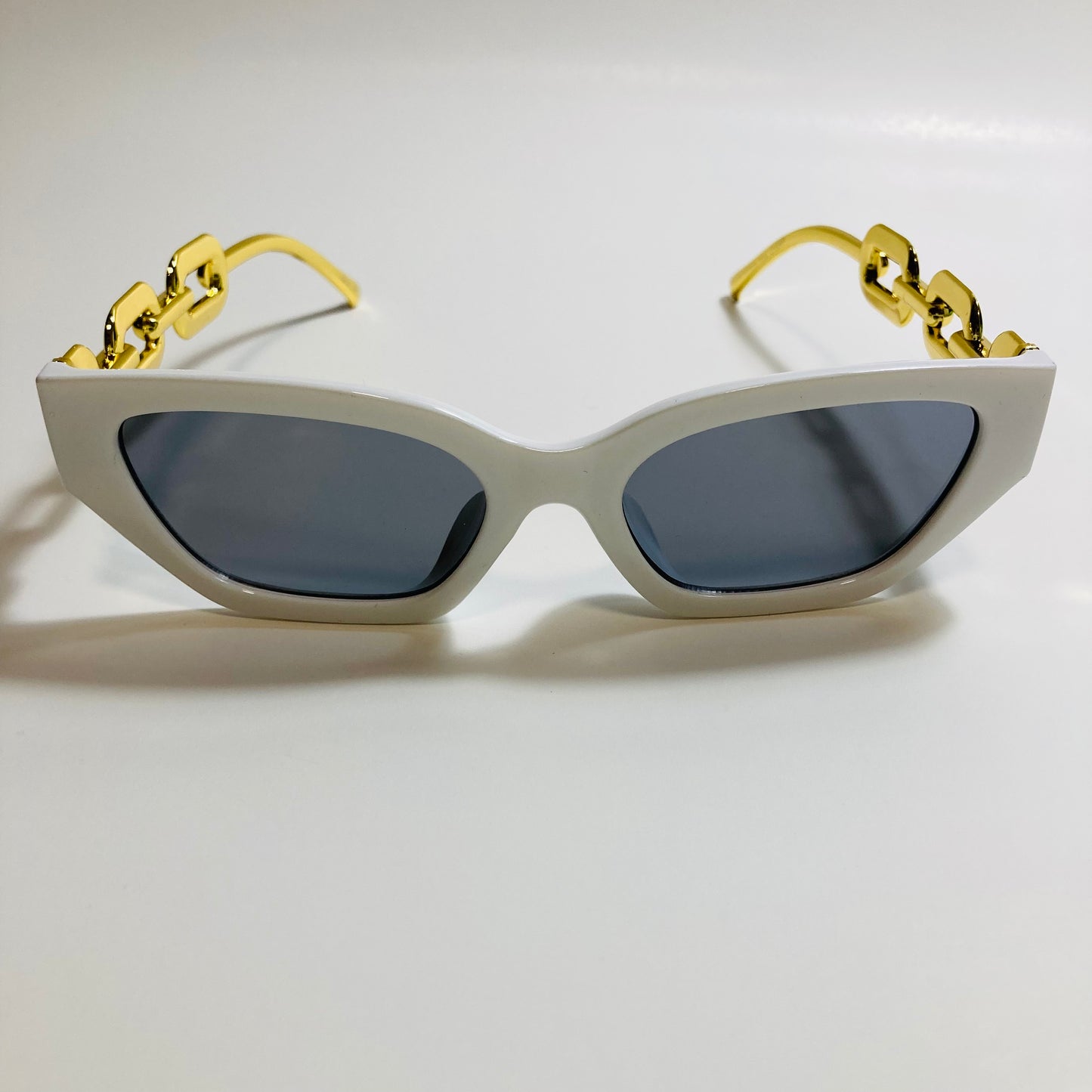 white and black square womens sunglasses with gold arms