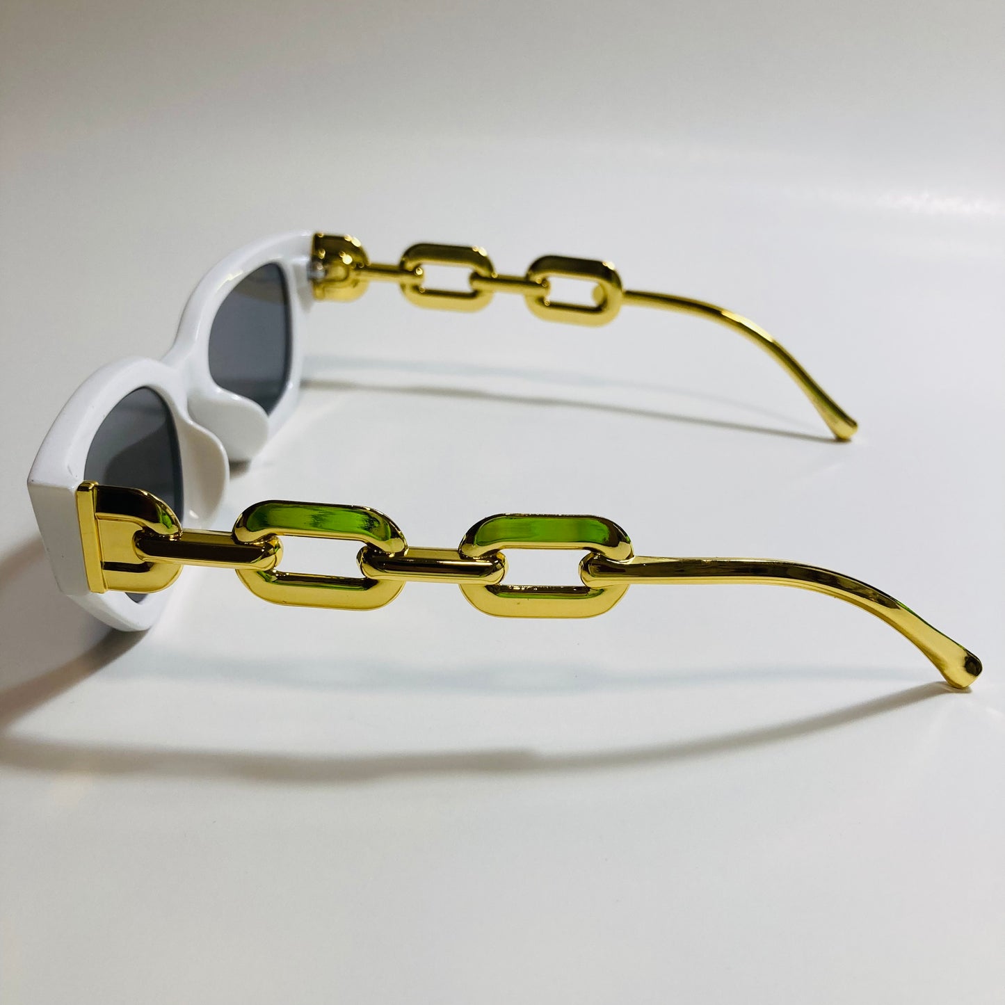 white and black square womens sunglasses with gold arms