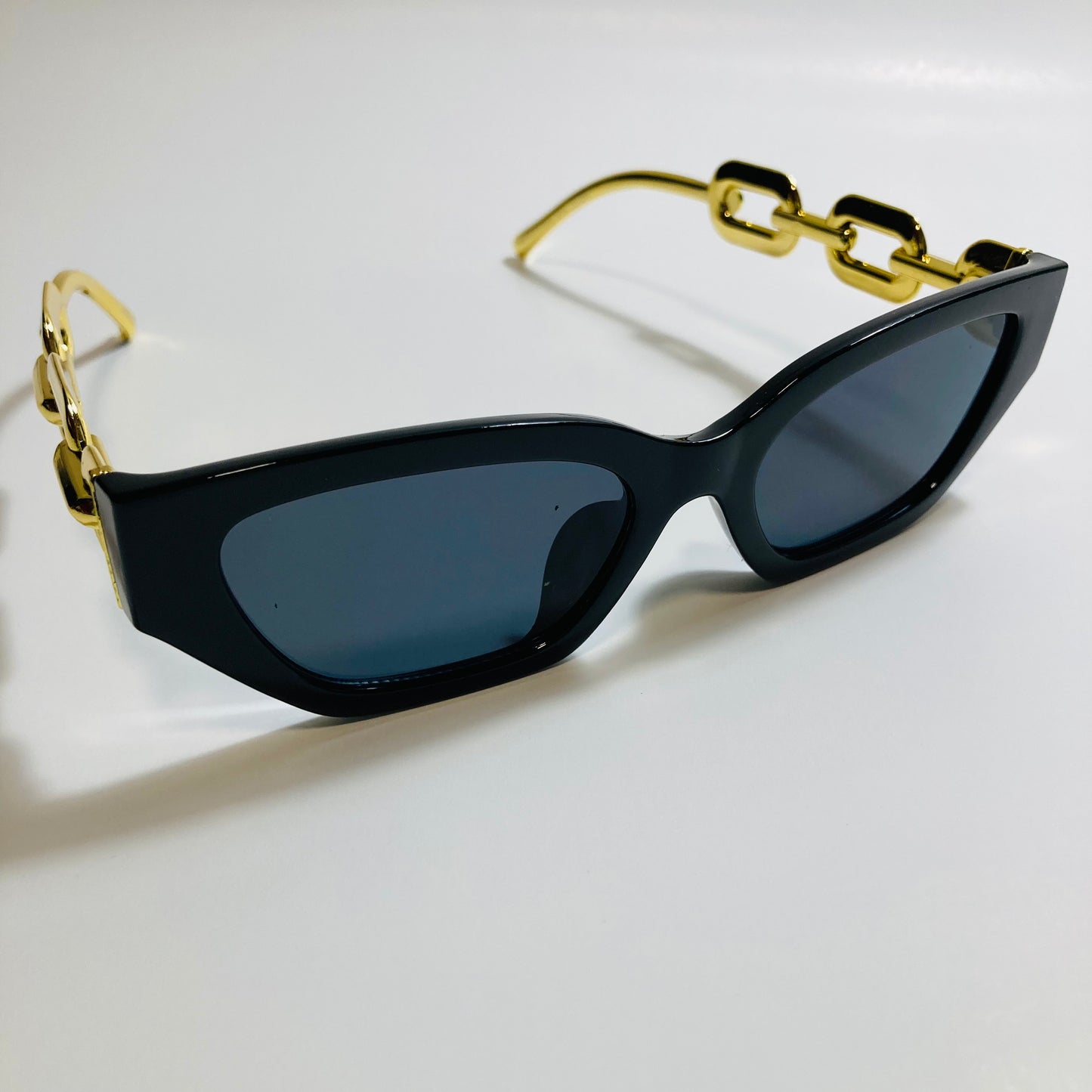 black square womens sunglasses with gold arms