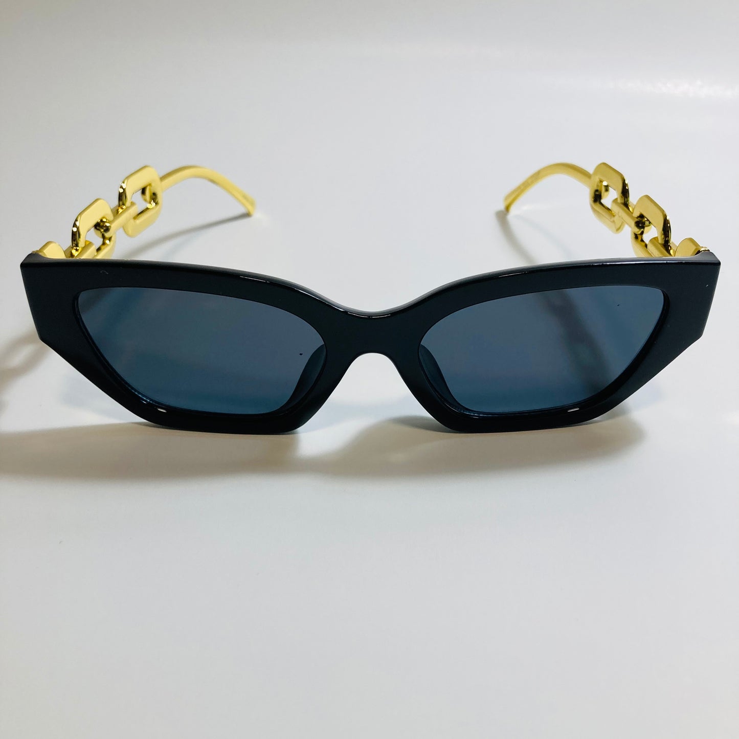 black square womens sunglasses with gold arms