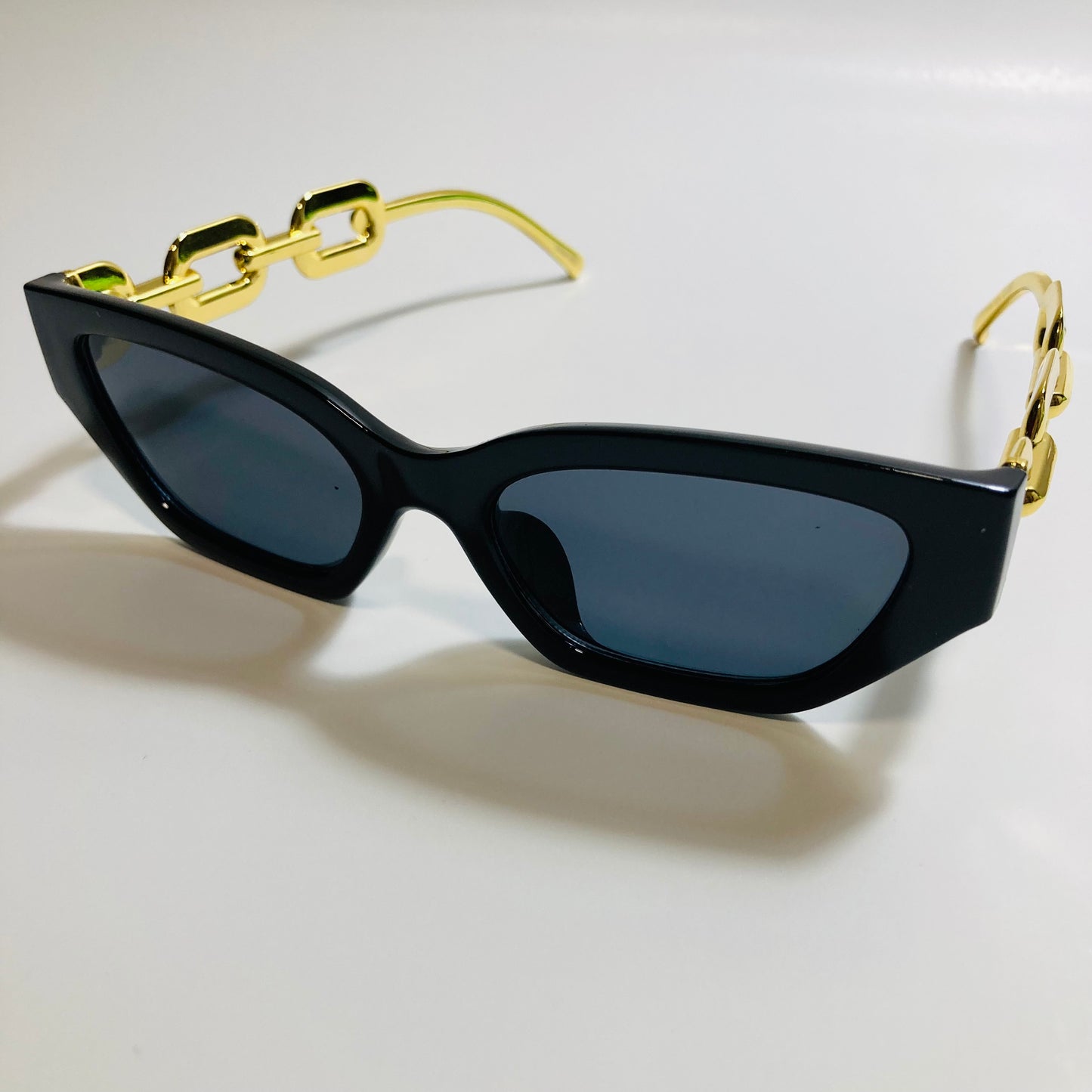 black square womens sunglasses with gold arms