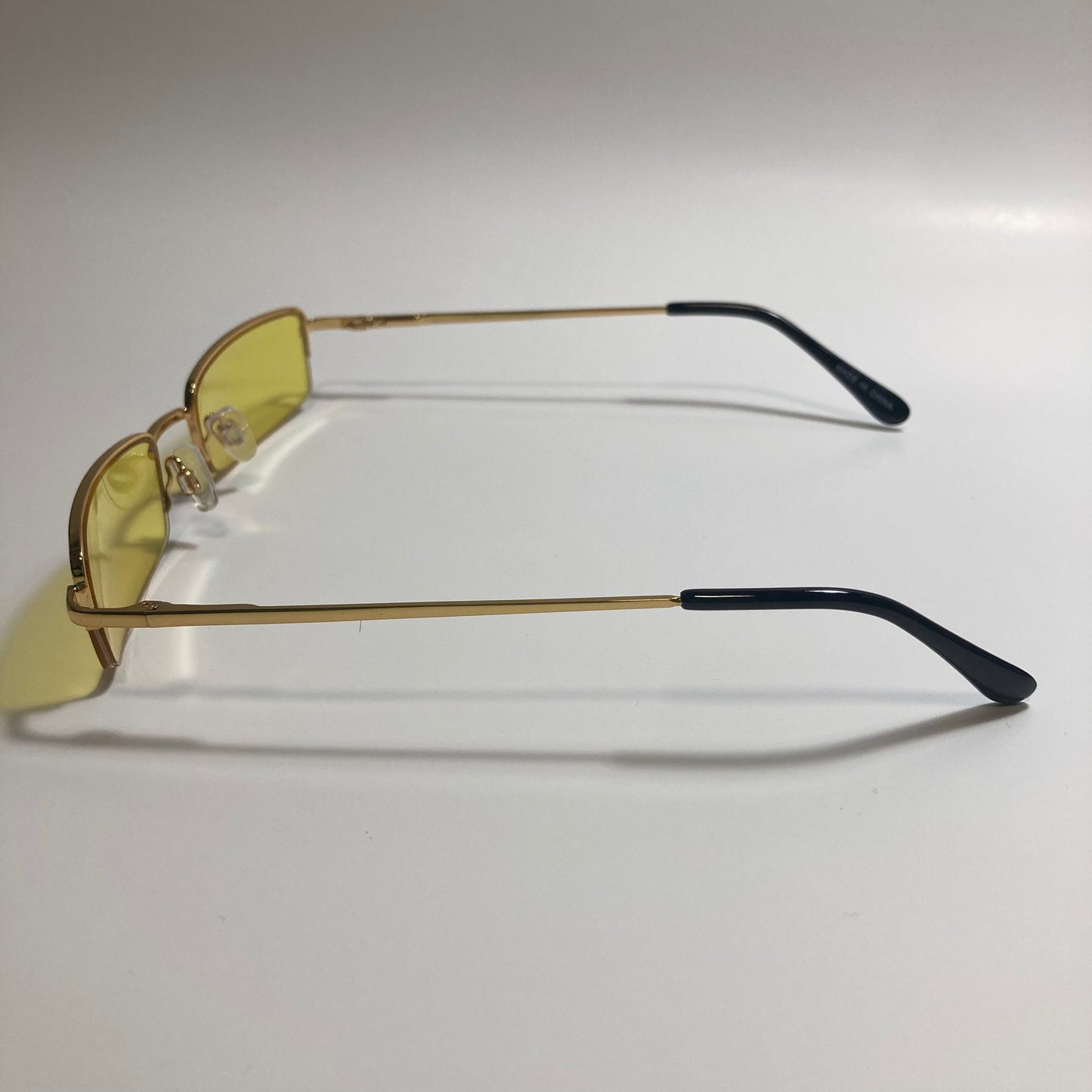 womens and mens yellow and gold metal square sunglasses