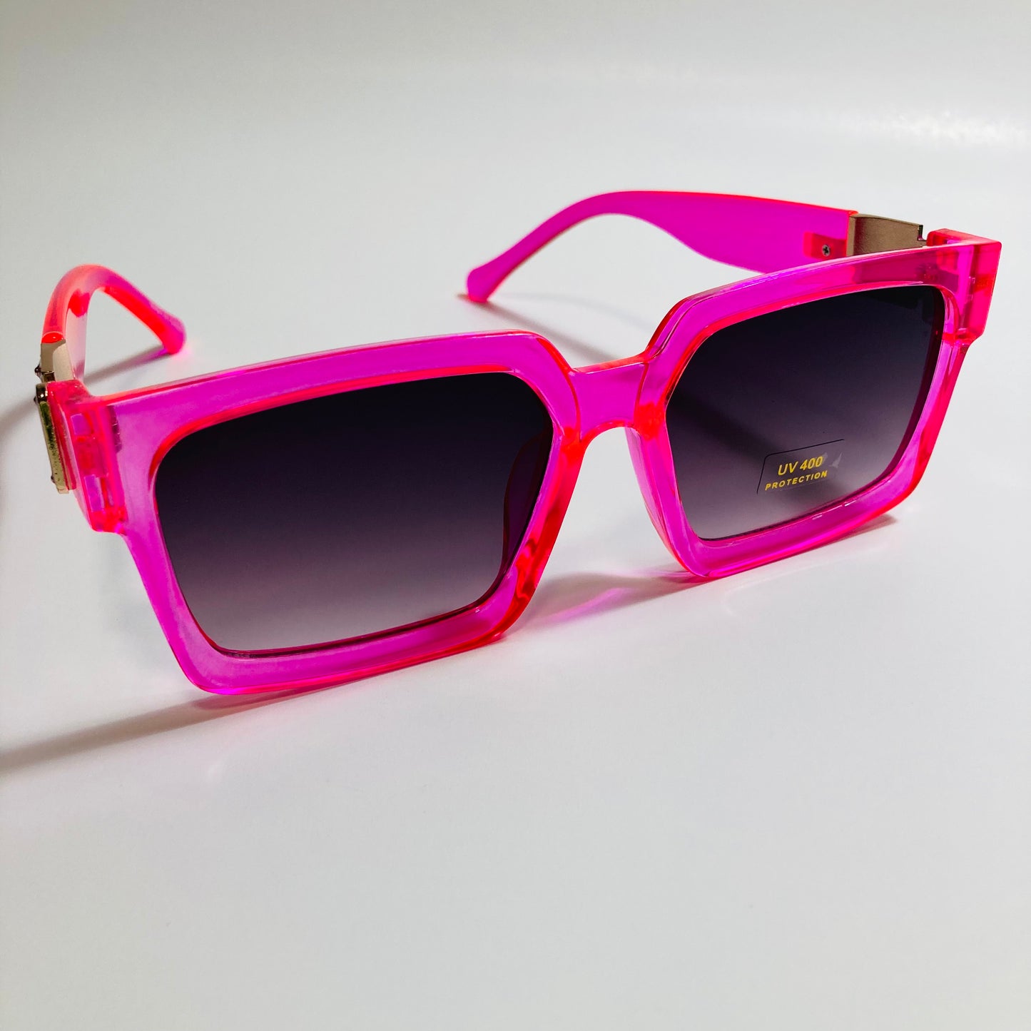 mens and womens pink black and gold square sunglasses
