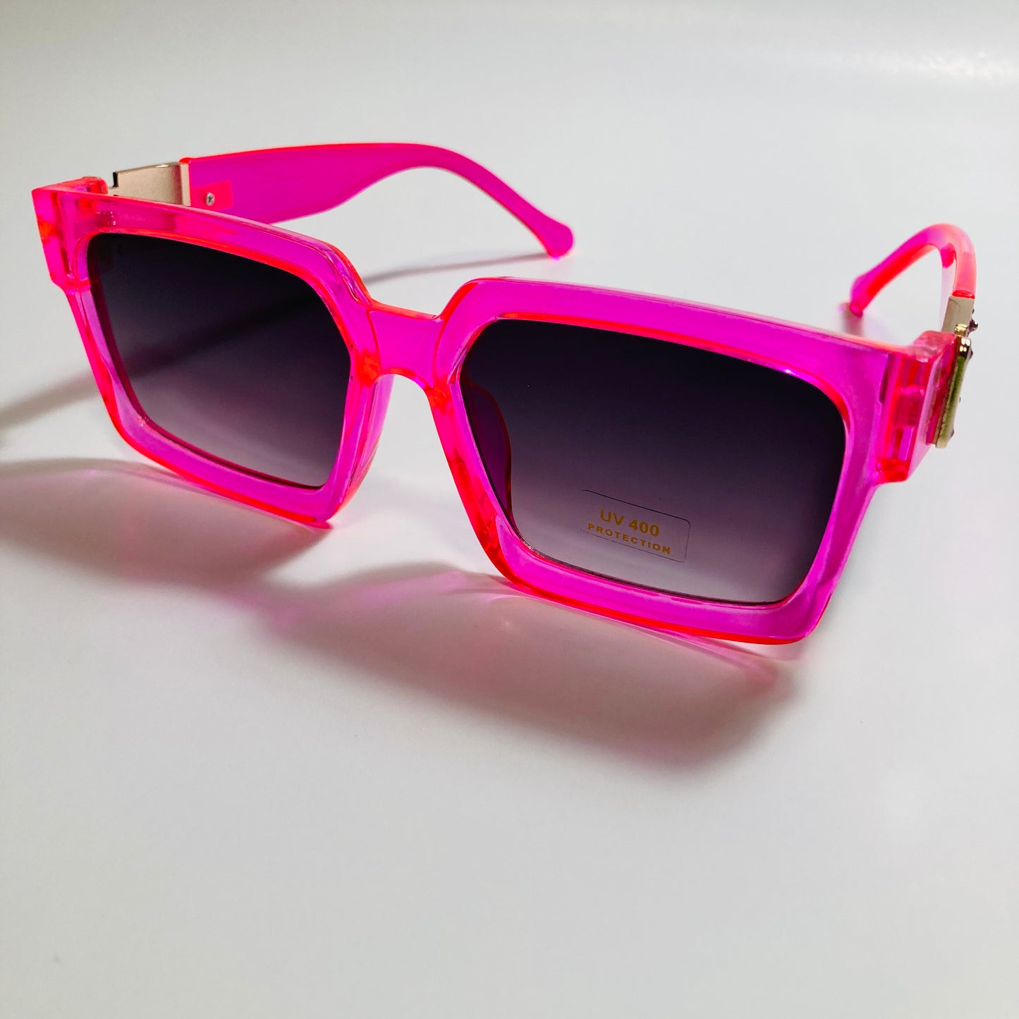 mens and womens pink black and gold square sunglasses