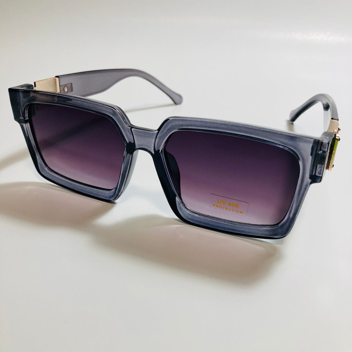 mens and womens gray black and gold square sunglasses