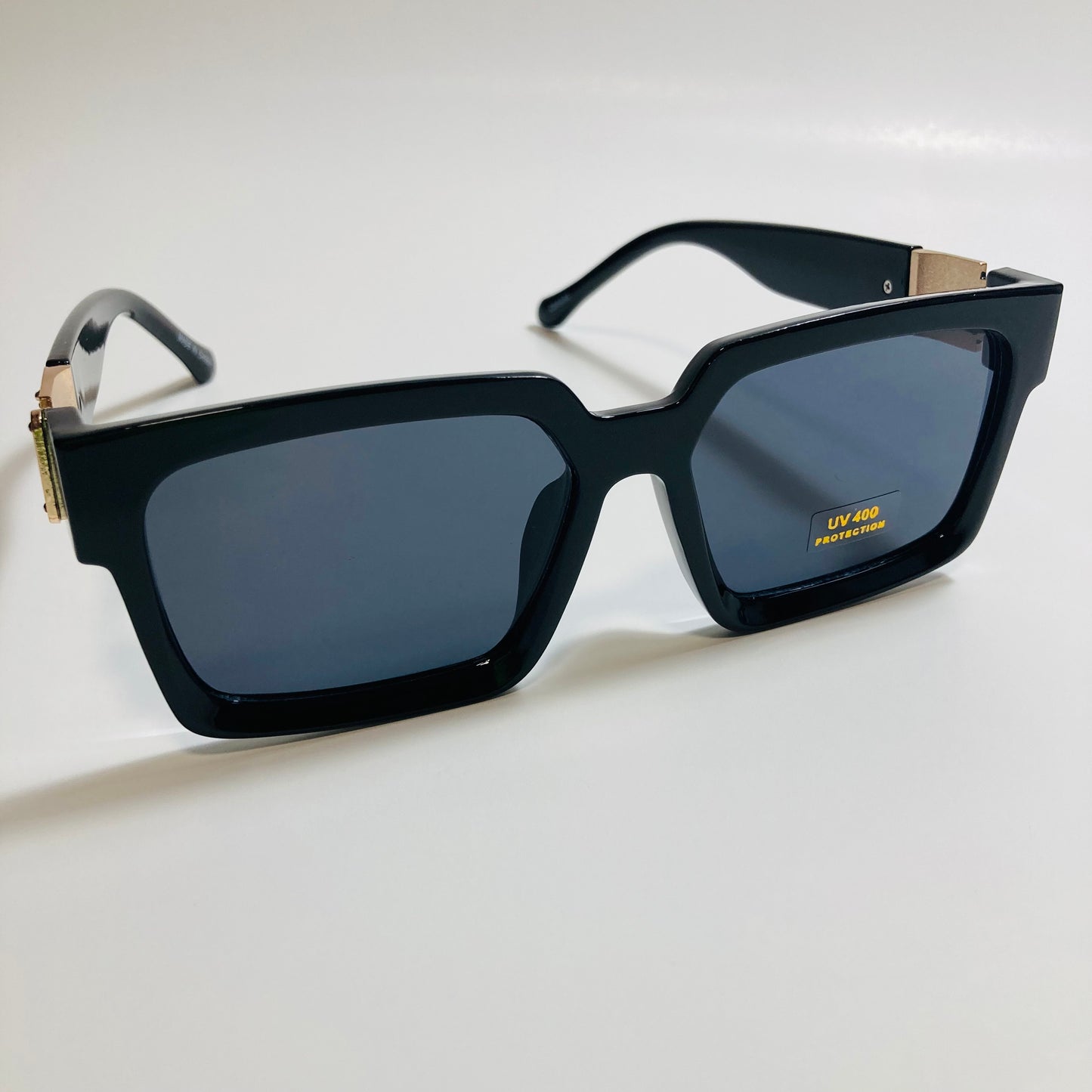mens and womens black and gold square sunglasses