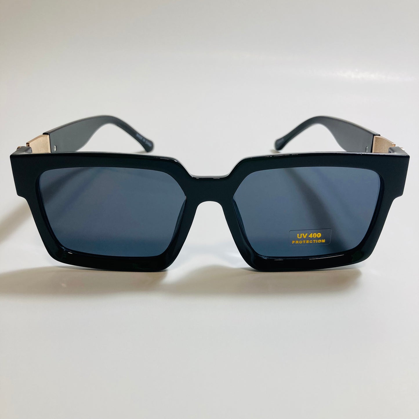 mens and womens black and gold square sunglasses