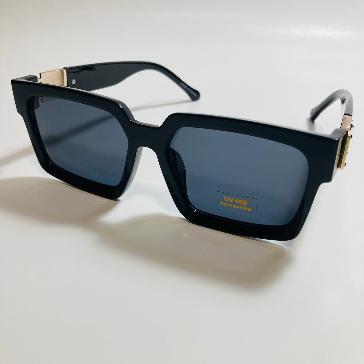 mens and womens black and gold square sunglasses