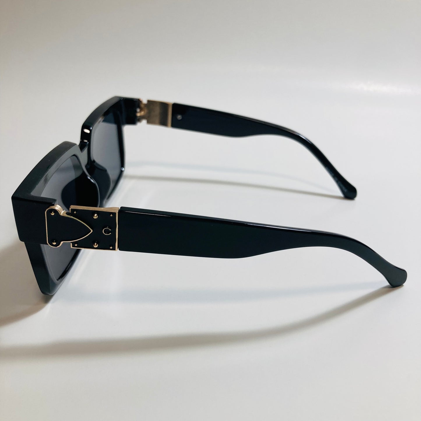 mens and womens black and gold square sunglasses