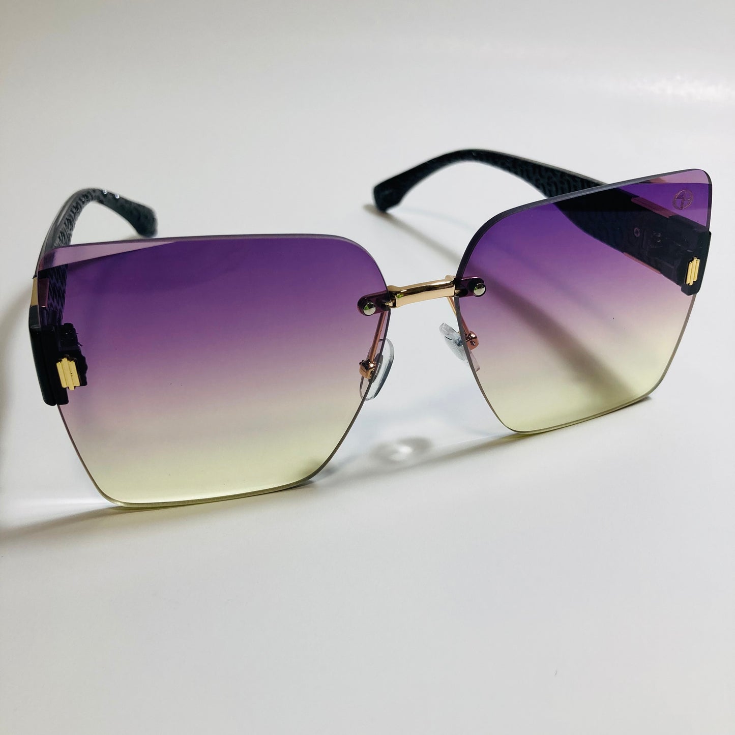 womens purple and yellow square rimless oversize sunglasses