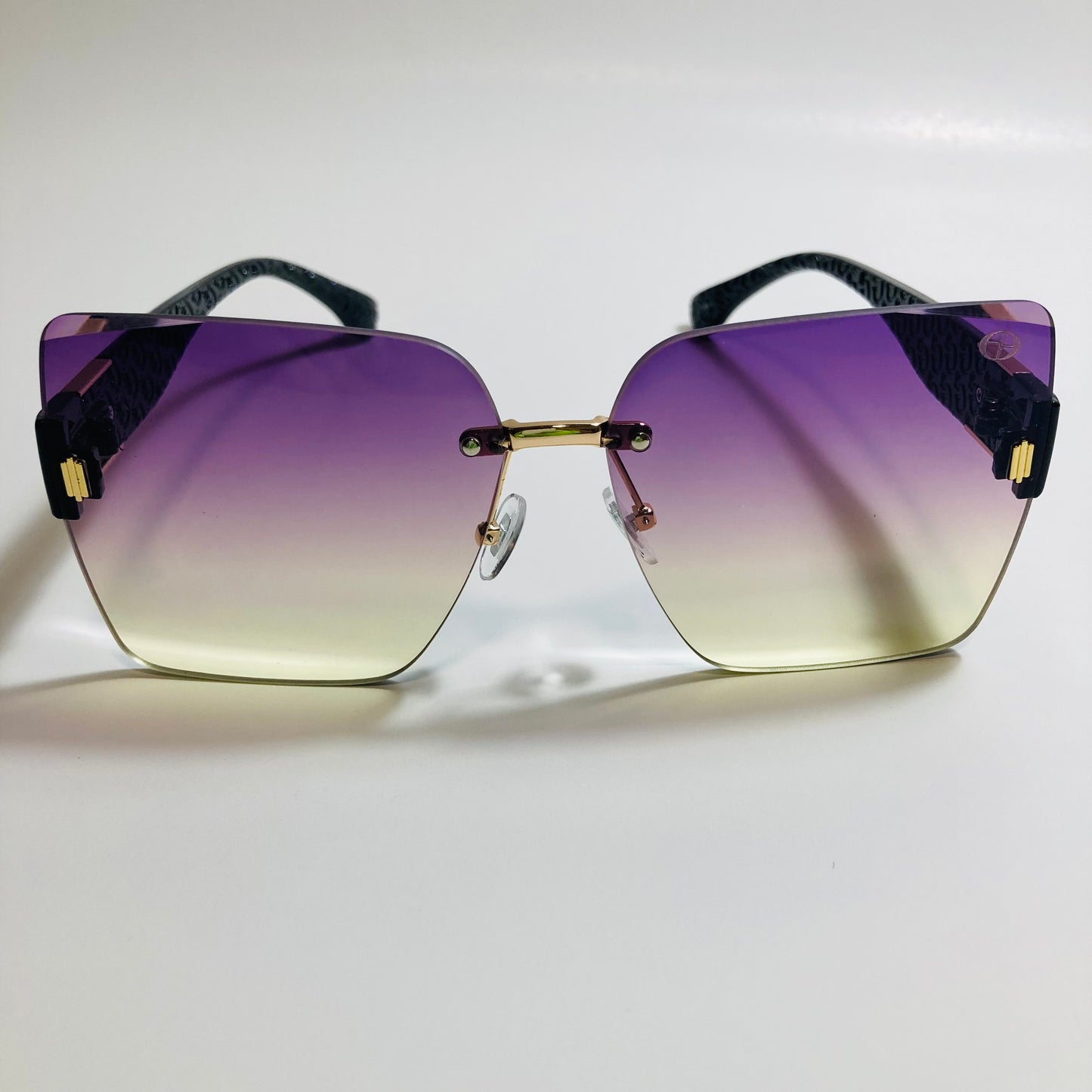 womens purple and yellow square rimless oversize sunglasses