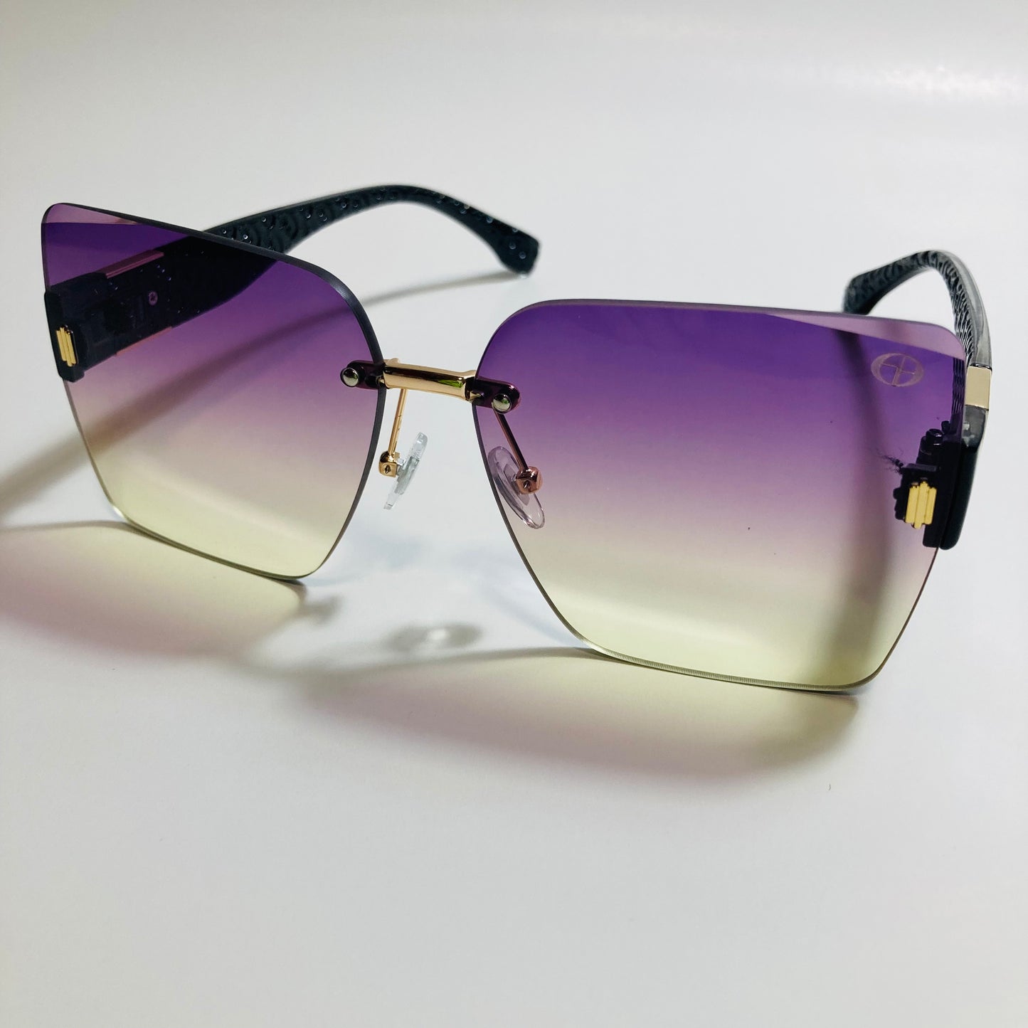 womens purple and yellow square rimless oversize sunglasses
