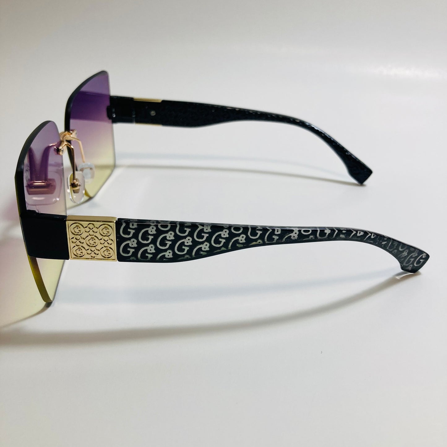 womens purple and yellow square rimless oversize sunglasses