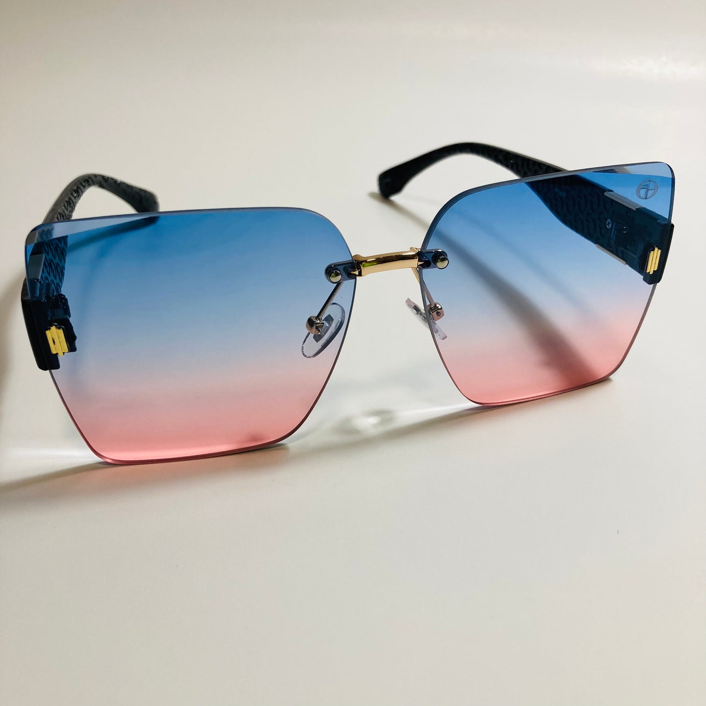 womens pink and blue square rimless oversize sunglasses