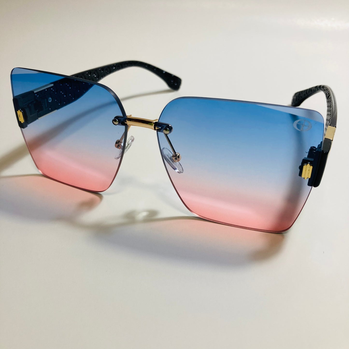 womens pink and blue square rimless oversize sunglasses