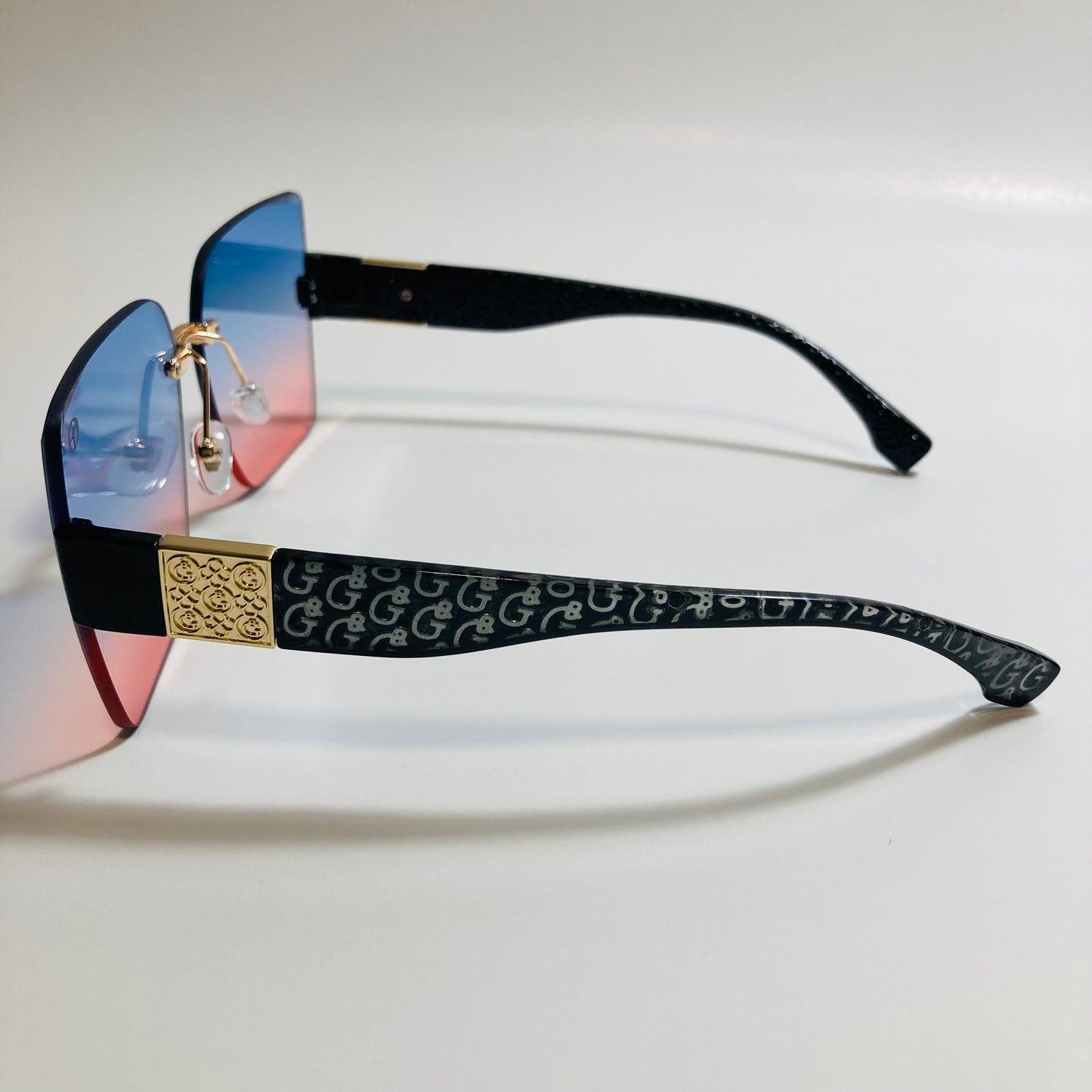 womens pink and blue square rimless oversize sunglasses