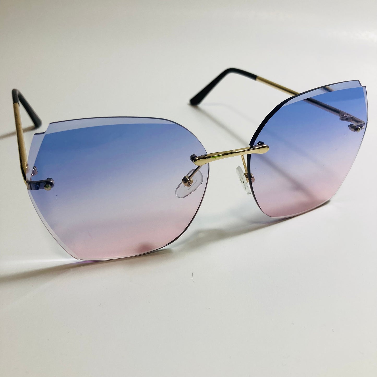 womens blue and pink oversize rimless sunglasses