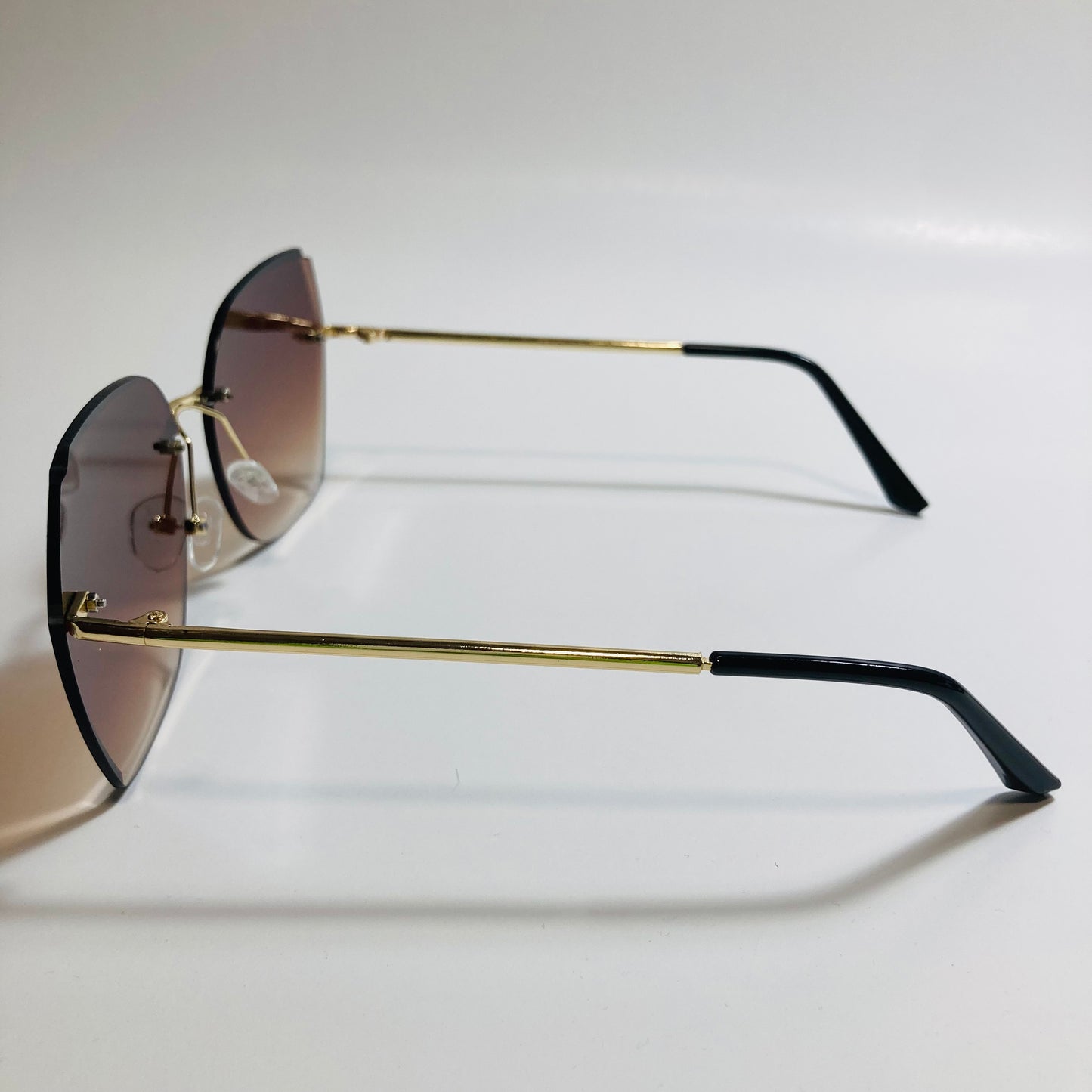womens brown oversize rimless sunglasses
