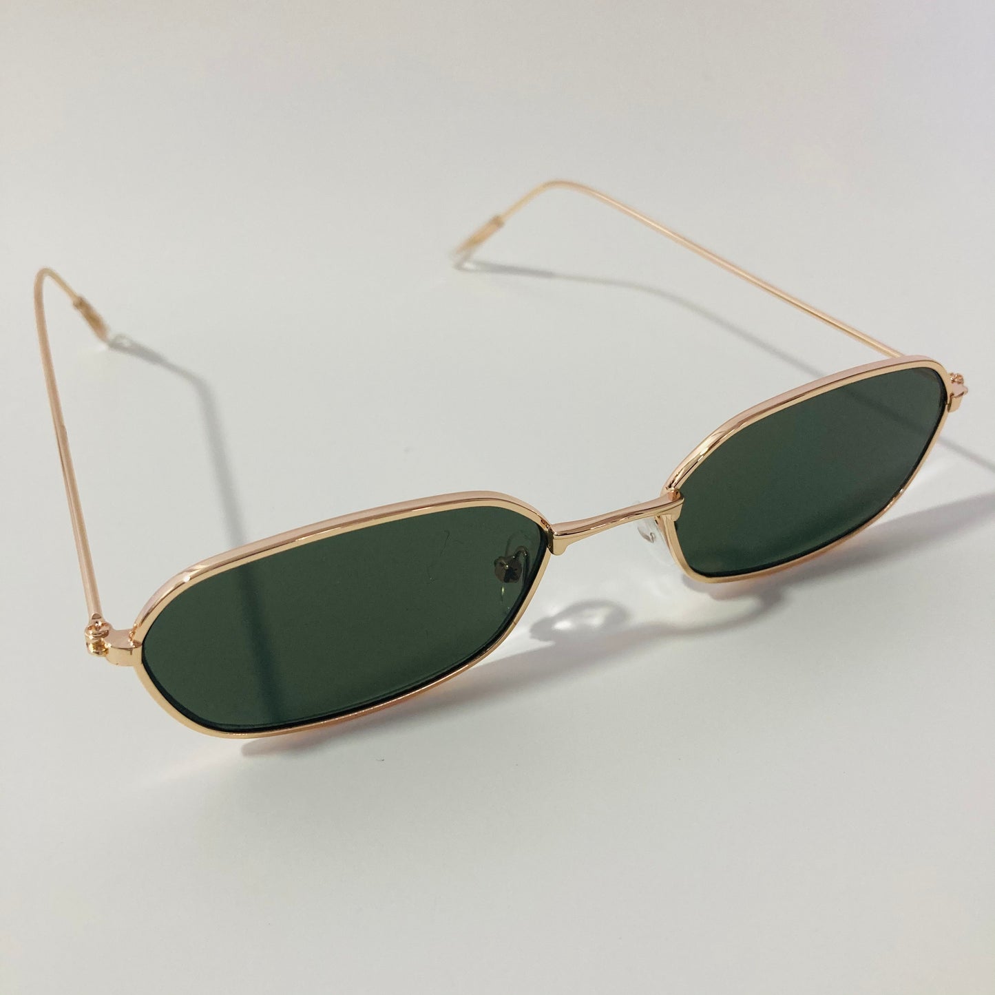mens and womens green and gold oval sunglasses