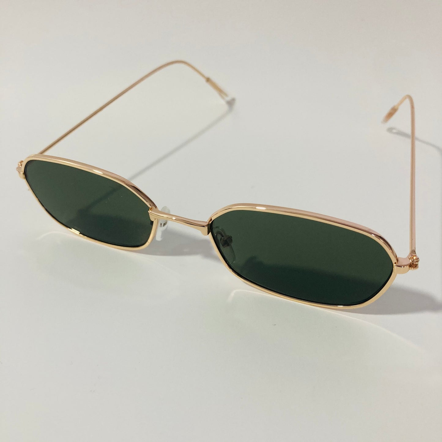 mens and womens green and gold oval sunglasses