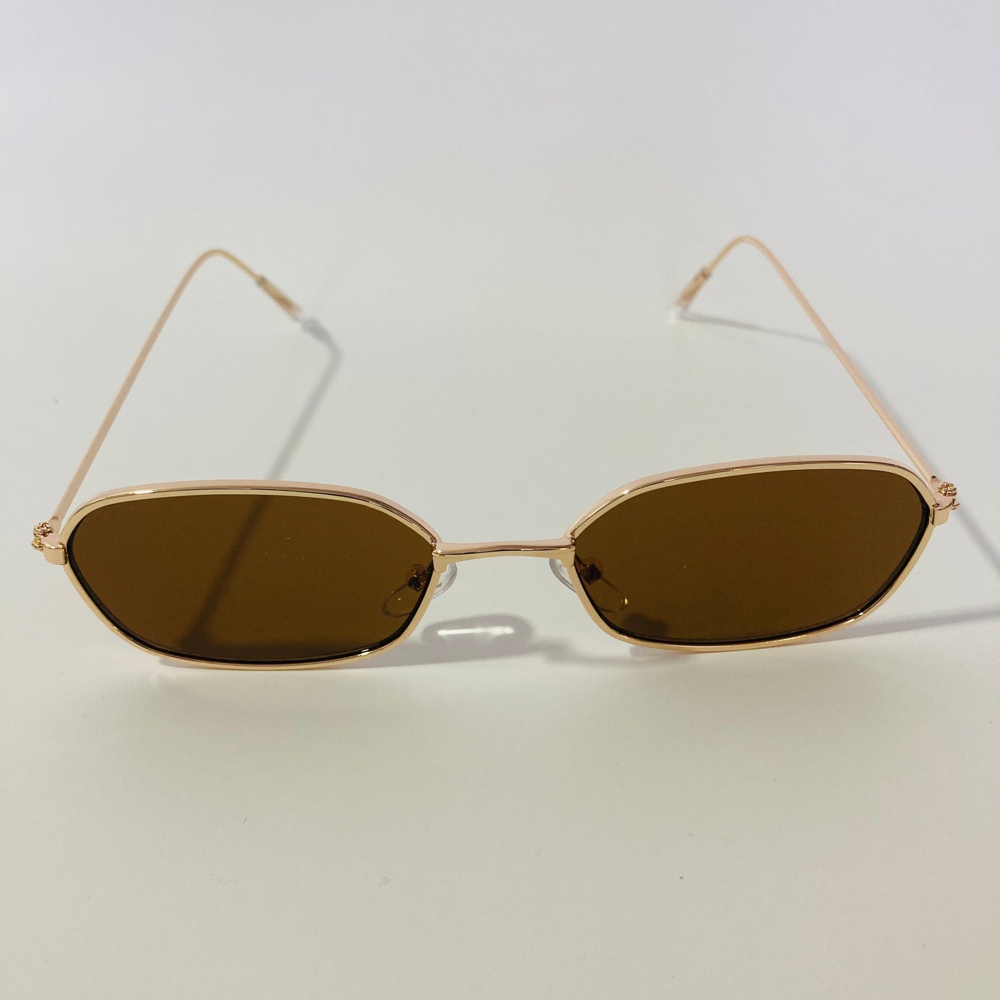 mens and womens brown and gold oval sunglasses