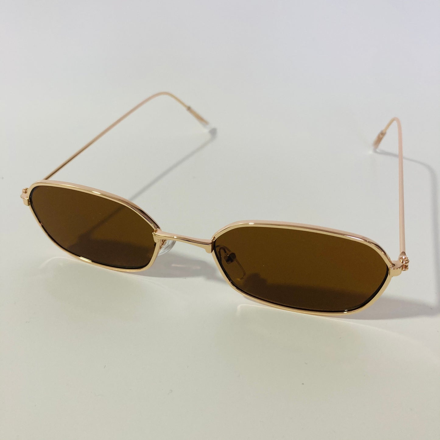 mens and womens brown and gold oval sunglasses