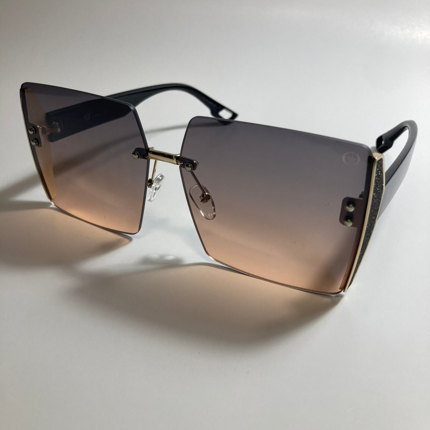 womens black and pink rimless oversize square sunglasses