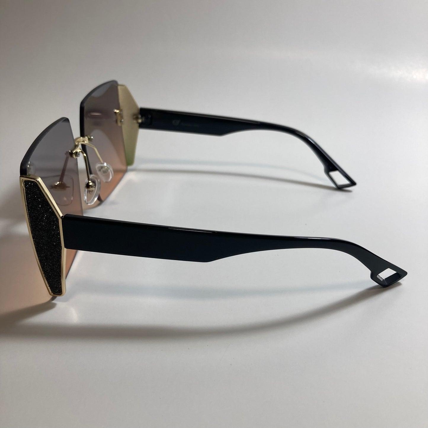 womens black and pink rimless oversize square sunglasses