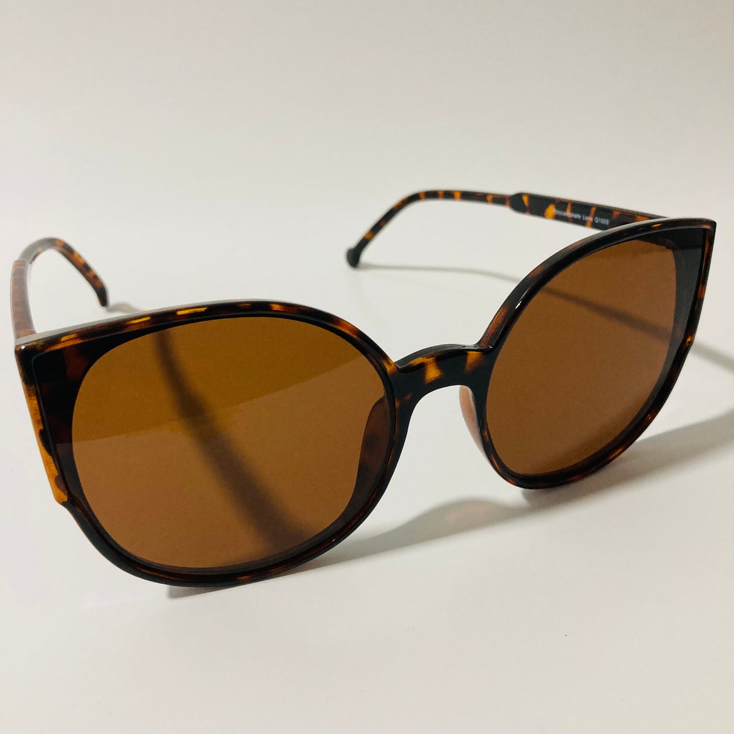 womans brown mirrored cat eye sunglasses