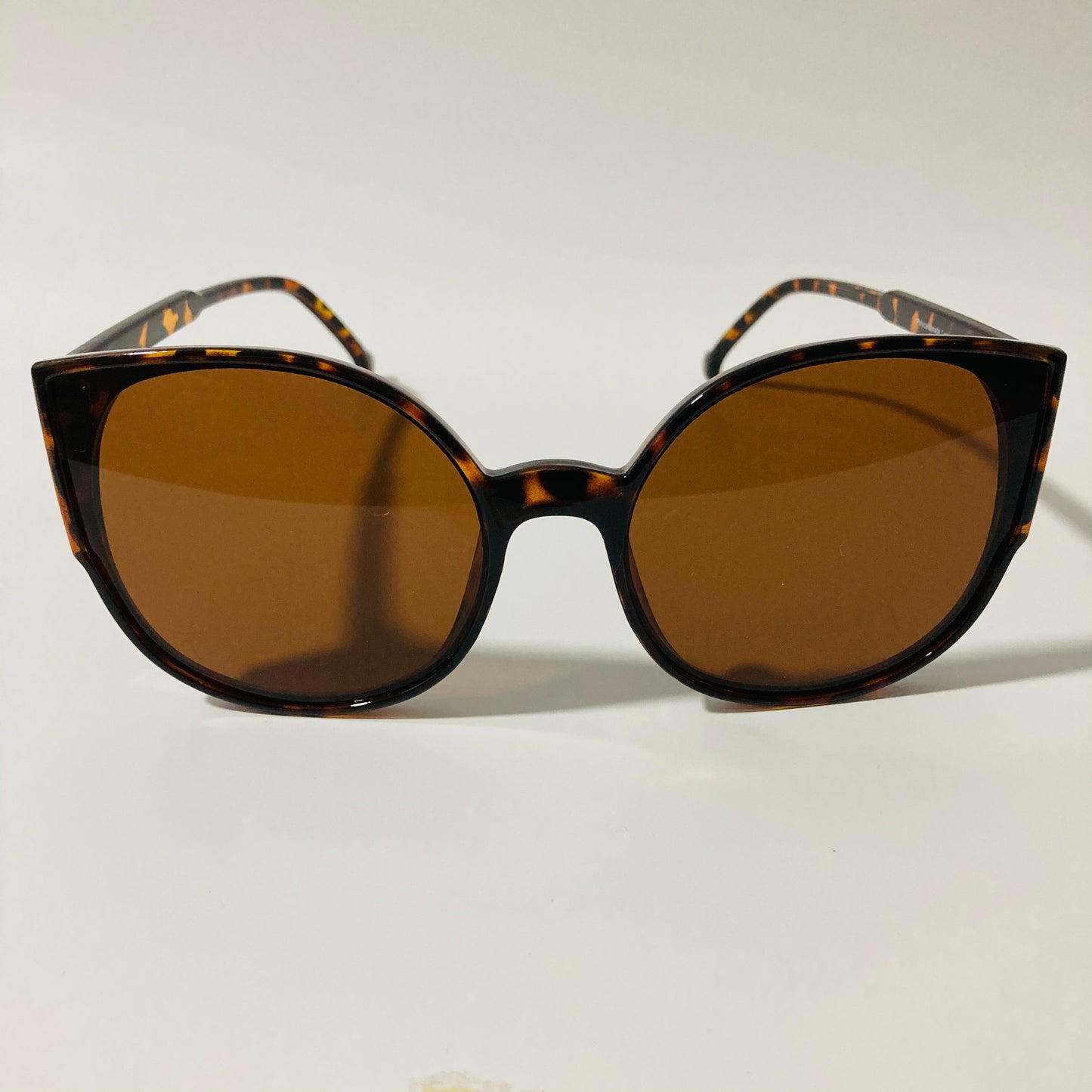 womans brown mirrored cat eye sunglasses