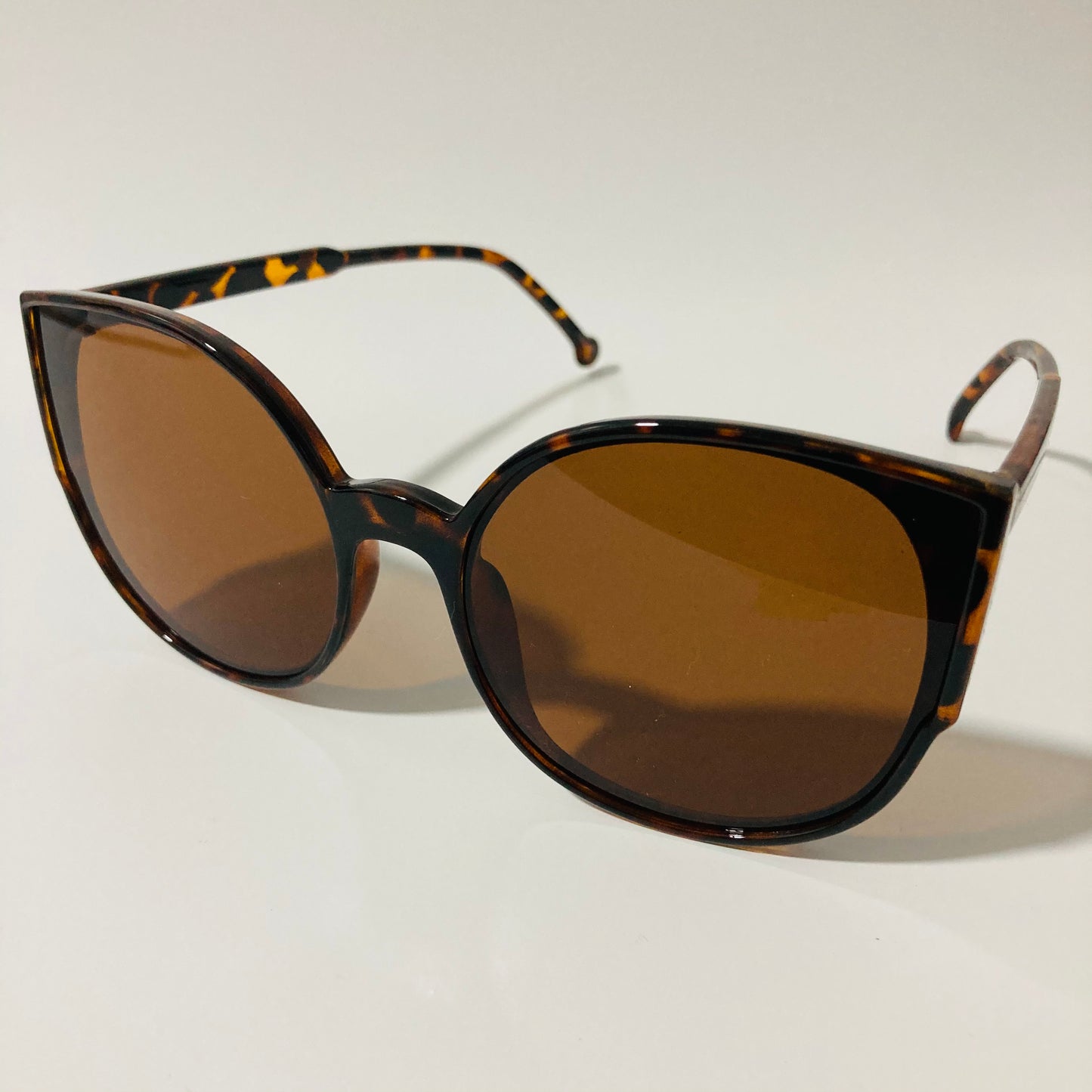 womans brown mirrored cat eye sunglasses
