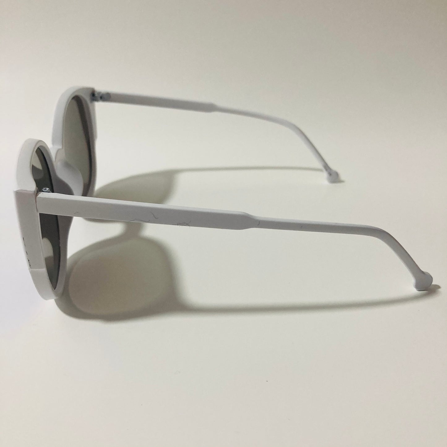 womans white and blue mirrored cat eye sunglasses