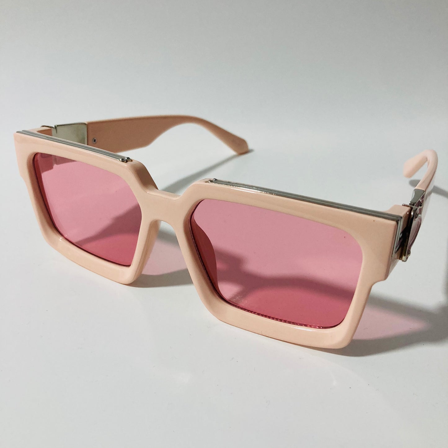 mens and womens pink square sunglasses with silver accents