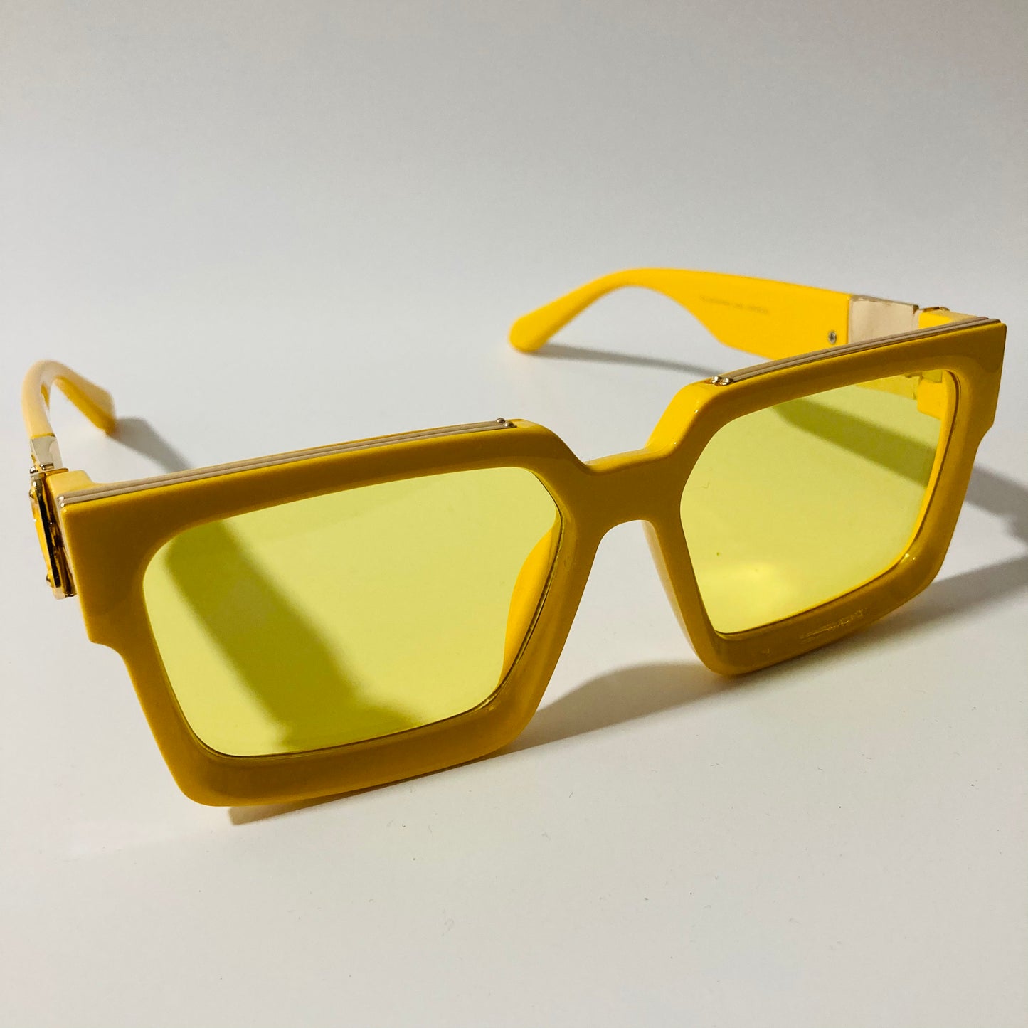 mens and womens yellow square sunglasses with gold accents