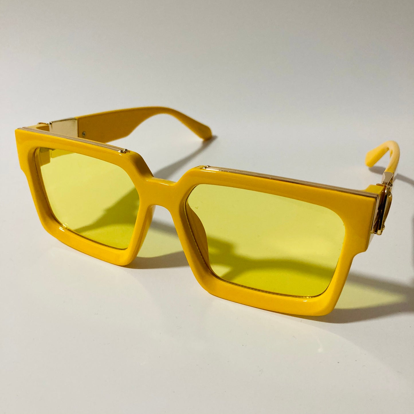 mens and womens yellow square sunglasses with gold accents