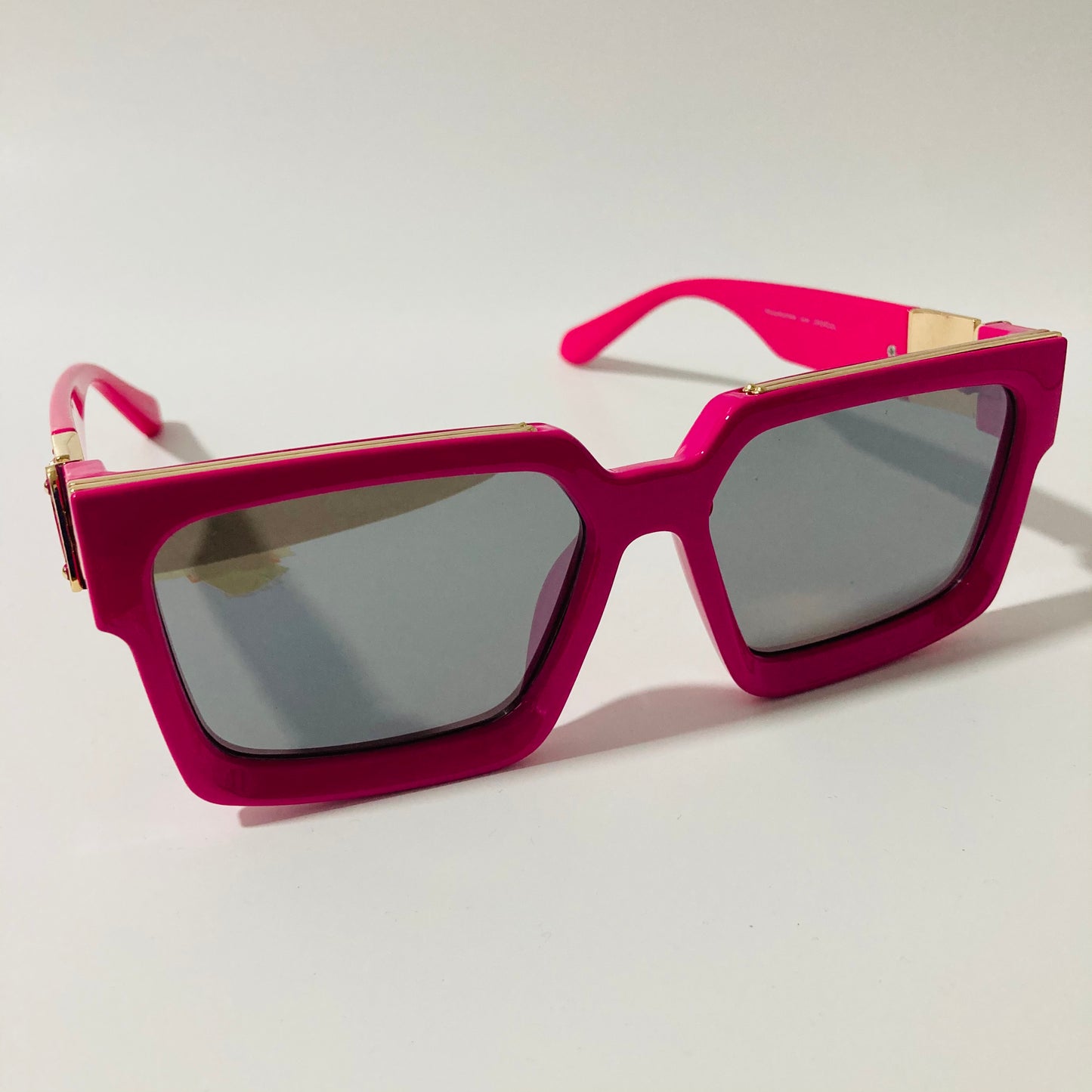 mens and womens pink and black square sunglasses with gold accents